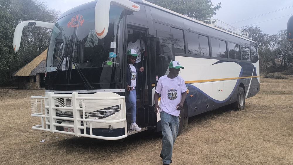 Passengers disembarking a Senya Trans coach